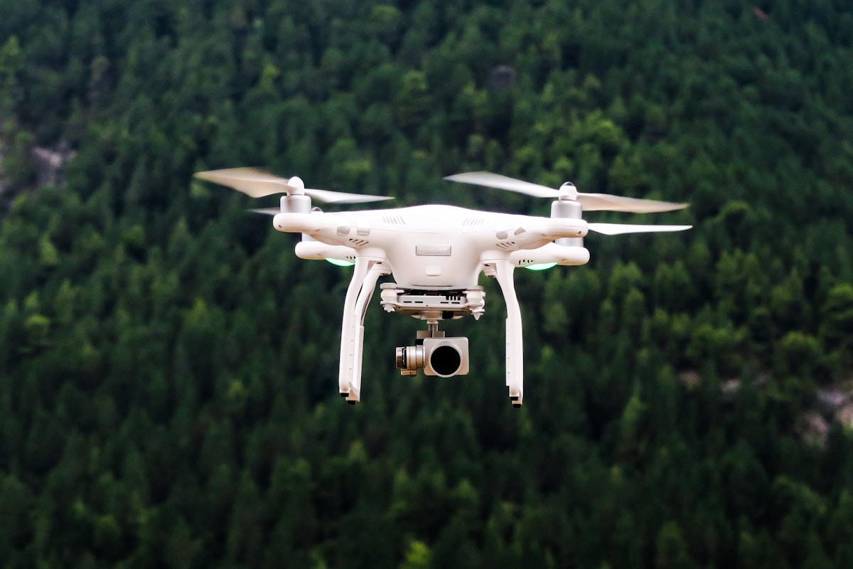 Small unmanned aircraft flying a survey line over open land